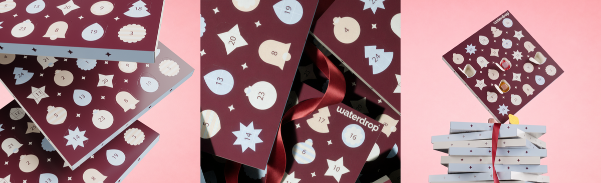Collage of burgundy gift wrap with white shapes and a stack of wrapped presents tied with a red ribbon on a pink background.