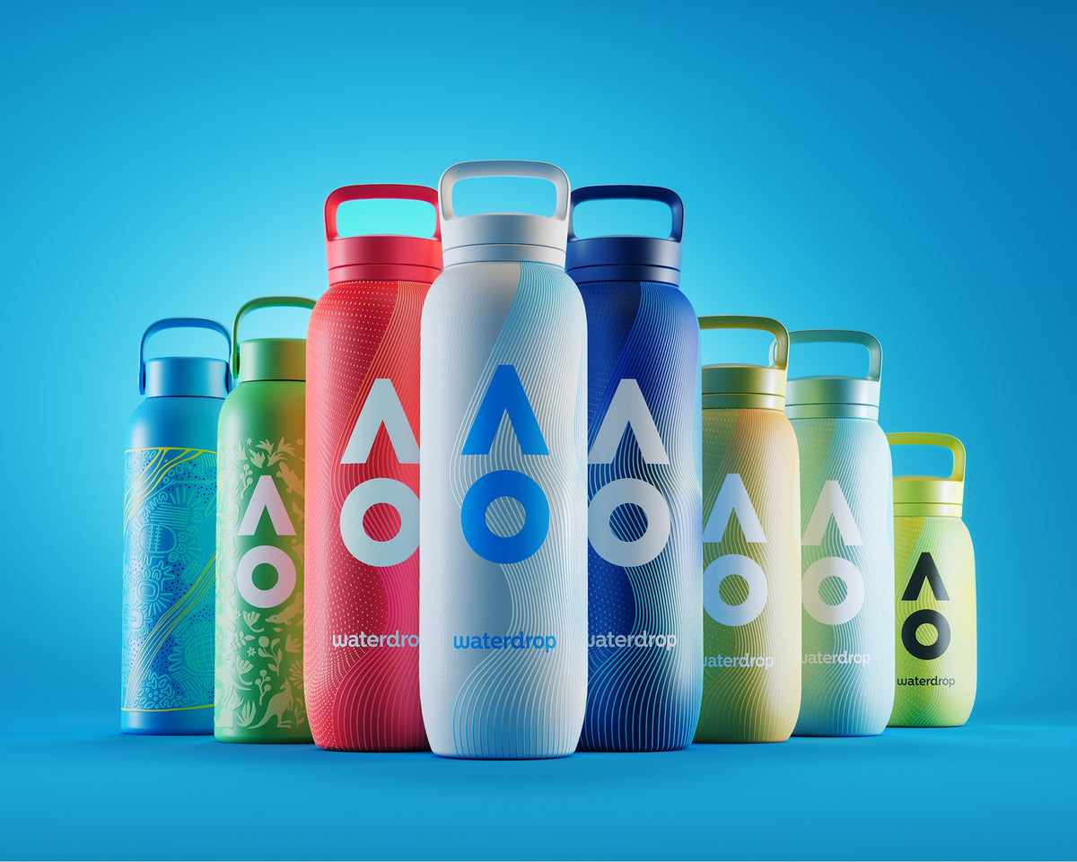 Row of colorful reusable water bottles with handles against a blue background.