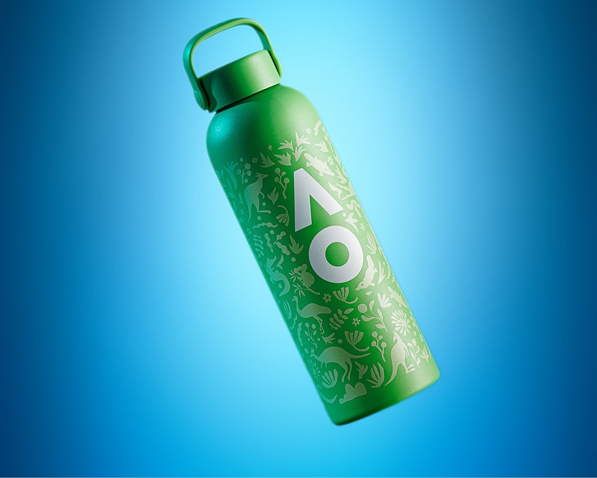 Green reusable water bottle with a loop-cap and decorative white pattern on a blue background.